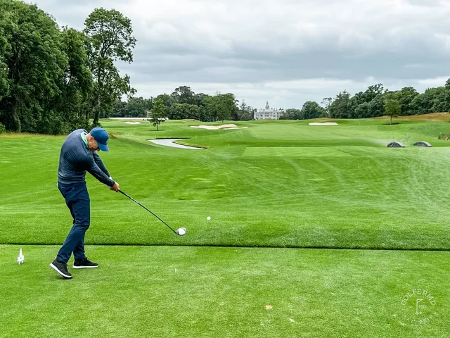 A group of golfers at Adare Manor, with the course behind them.