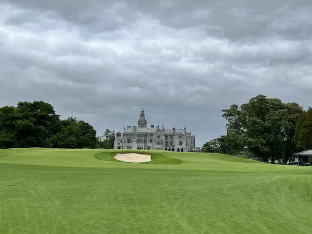 A wide view across Adare Manor, with fairway, water, and the estate.