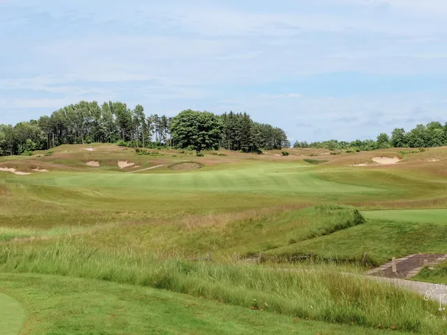 A fairway at Arcadia Bluffs running along the bluff, with Lake Michigan beyond.