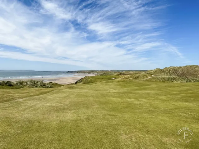 Golfers on a tee on the Cashen Course, with the Atlantic behind them.