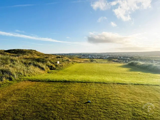 A fairway on the Old Course at Ballybunion running through the dunes toward the Atlantic.