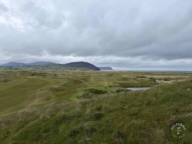 A fairway on the Glashedy Links running through the dunes toward the water.