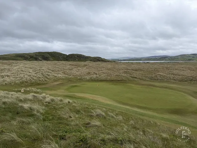 Golfers on a tee on the Glashedy Links, with the Atlantic behind them.