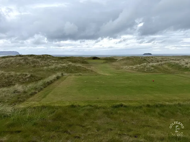 A fairway on the Glashedy Links with a bunker along one side and the Atlantic ahead.