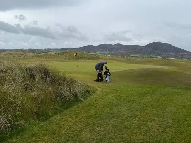 A wide hole on the Glashedy Links, the fairway running toward the water.