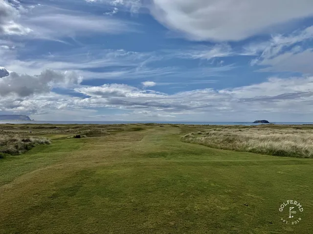 A fairway on the Old Links lined with dunes, running toward the water.
