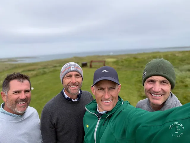 A group of golfers at Carne, with the ocean behind them.