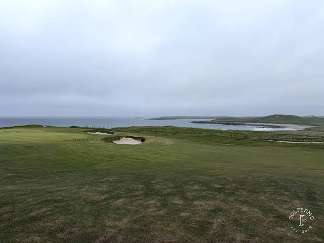 A fairway at Carne bending through the dunes.