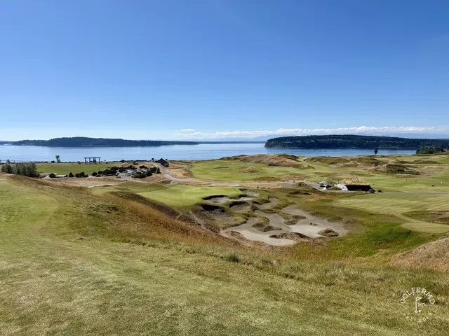A wide fairway at Chambers Bay, with the dunes and the water in the distance.