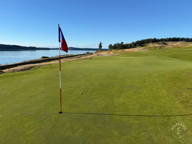 A wide hole at Chambers Bay, the fairway running toward the sound.