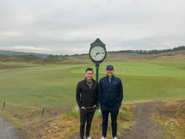 A fairway at Chambers Bay with a bunker in the foreground and Puget Sound beyond.