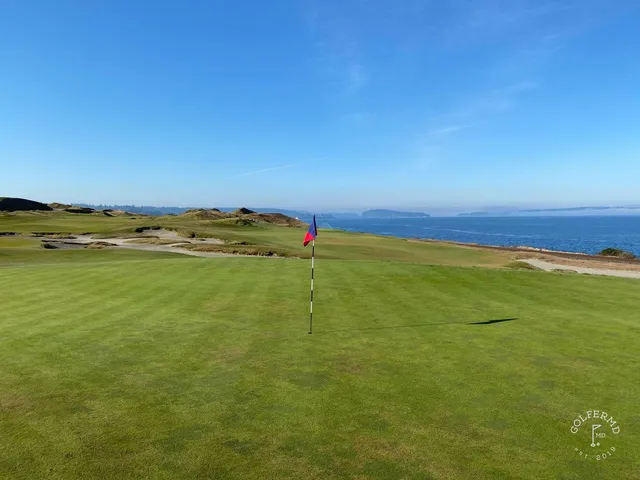 A fairway and green at Chambers Bay, with a bunker in the foreground.