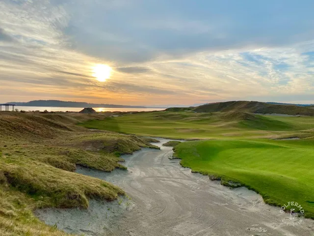 A fairway at Chambers Bay, with a bunker along the hole and the sound beyond.