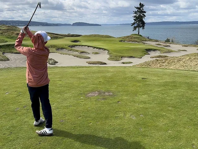 A wide view of Chambers Bay, with the course in front of Puget Sound.