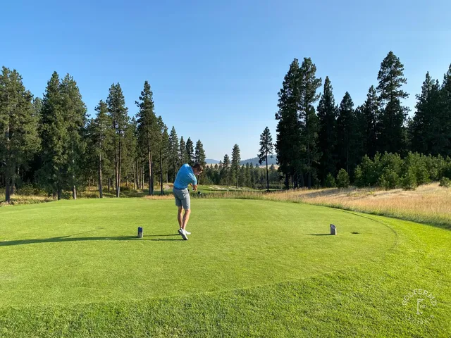 A green and flagstick at Circling Raven, with a bunker guarding the right side.