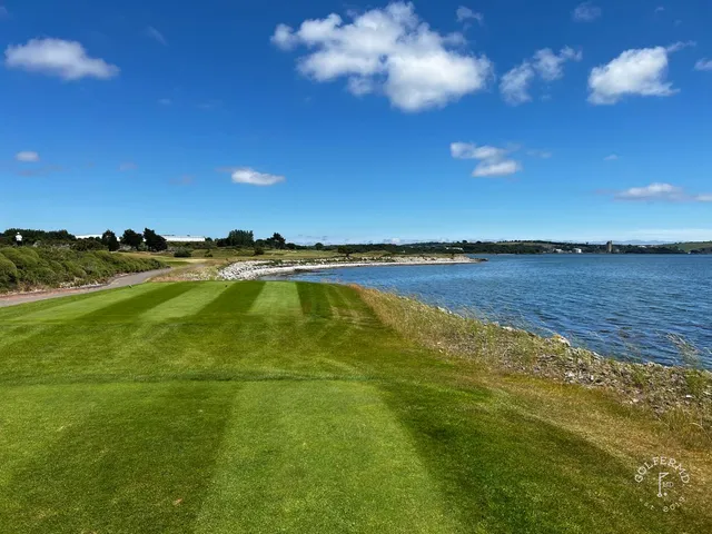 A wide view at Cork Golf Club, with the fairway and Cork Harbour in the distance.