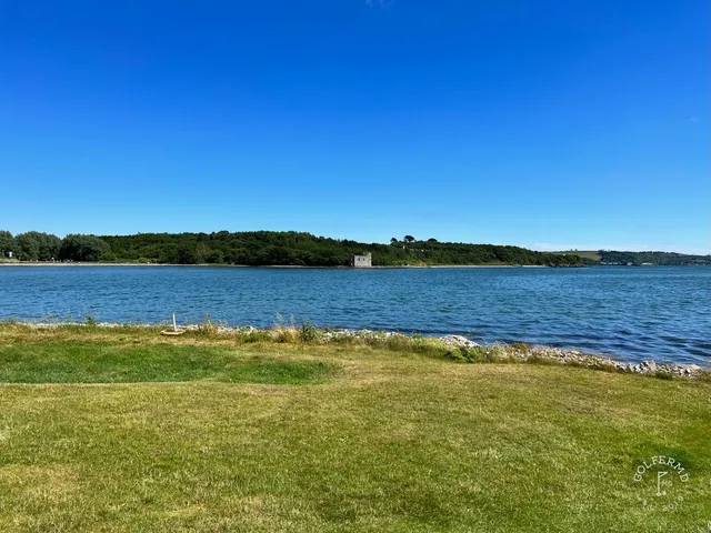A fairway at Cork Golf Club running toward Cork Harbour.