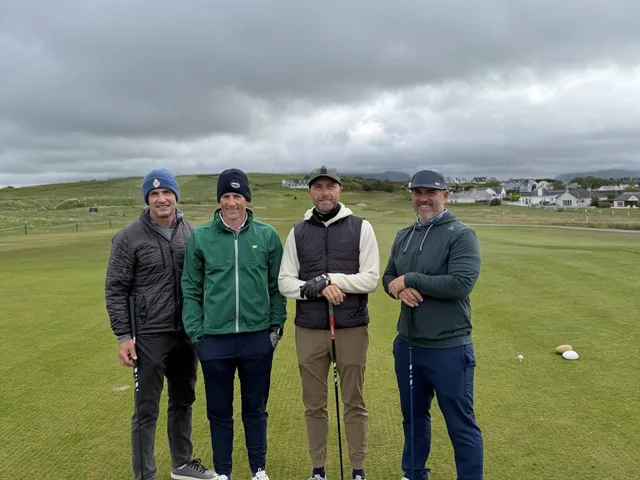 A wide view at County Sligo, with the fairway, the bay, and the mountain.