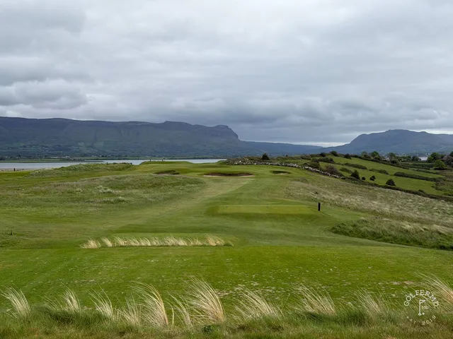 A wide view across County Sligo, with fairway, dunes, and the bay.