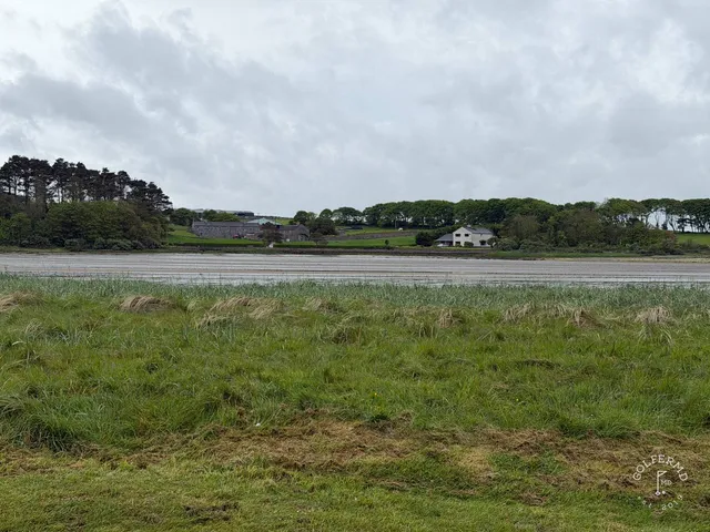 A fairway at Enniscrone lined with dunes, running toward the beach.