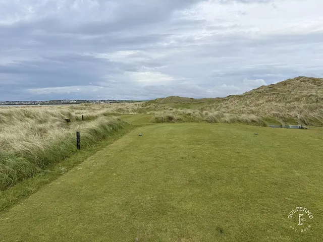 A group of golfers at Enniscrone, with the ocean behind them.