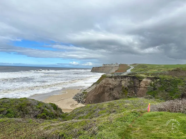 A fairway and green above the ocean at Half Moon Bay Golf Links Ocean Course.