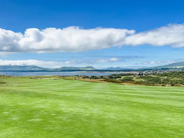 Golfers on a tee at Hogs Head, with the Atlantic behind them.