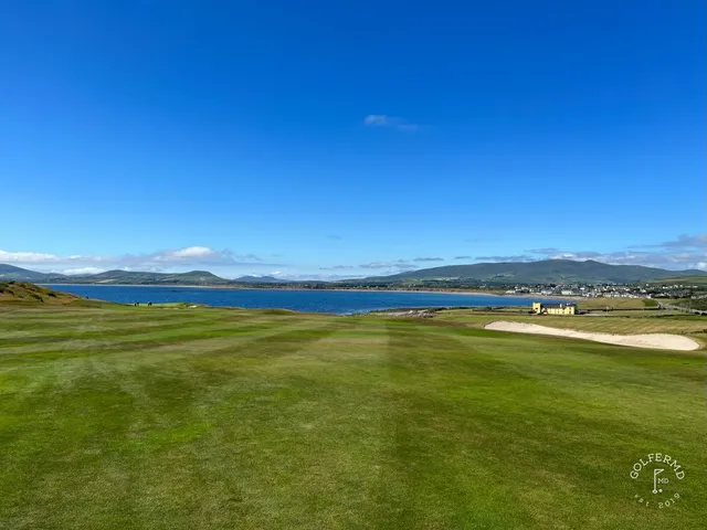 A wide view across Hogs Head, with fairway, dunes, and the ocean.