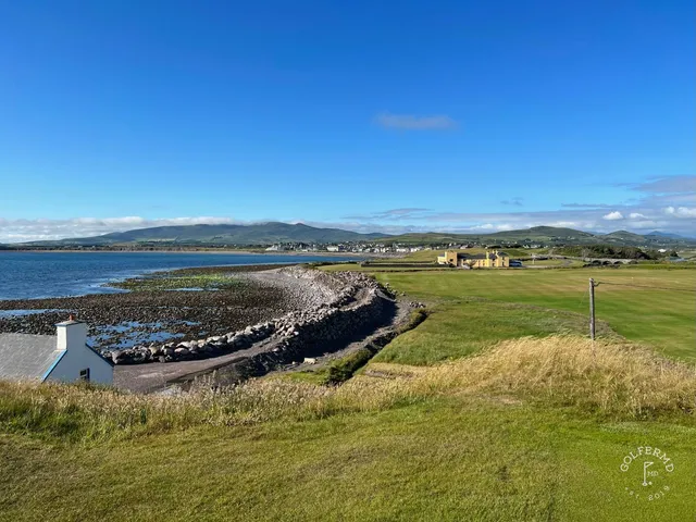 A green and flagstick at Hogs Head, with a large bunker guarding the front.