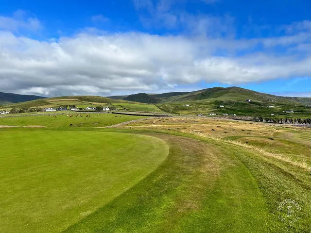 A wide view of the links at Hogs Head, with the water on the horizon.