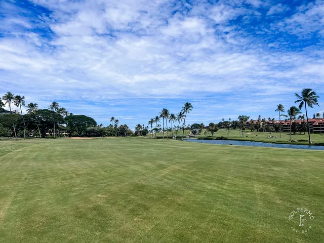 A fairway at the Royal Kaʻanapali Course running toward the ocean, with palm trees along the hole.