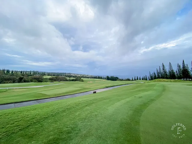 A wide fairway at the Plantation Course at Kapalua, with the ocean on the horizon.