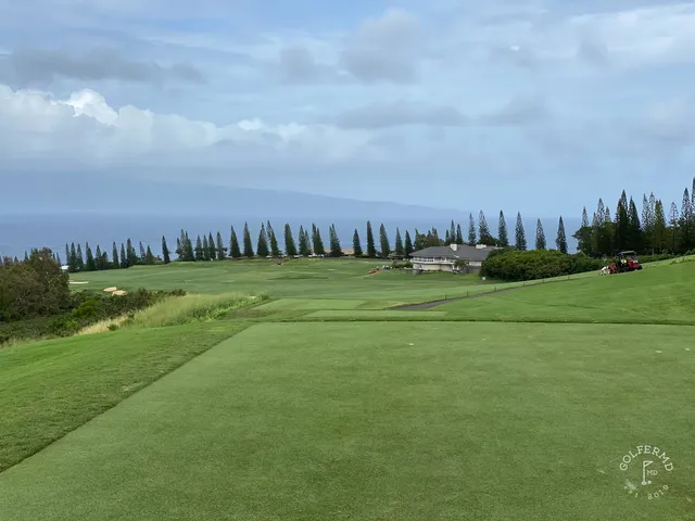 A wide fairway at the Plantation Course running toward the water.