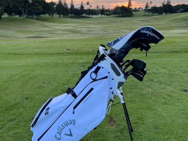 A scorecard and yardage book for Ko Olina Golf Club on a table.