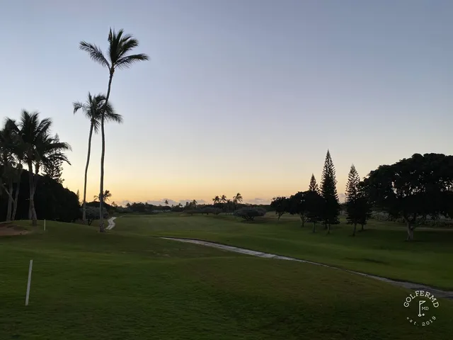 A tee marker at Ko Olina, with the fairway and ocean beyond it.