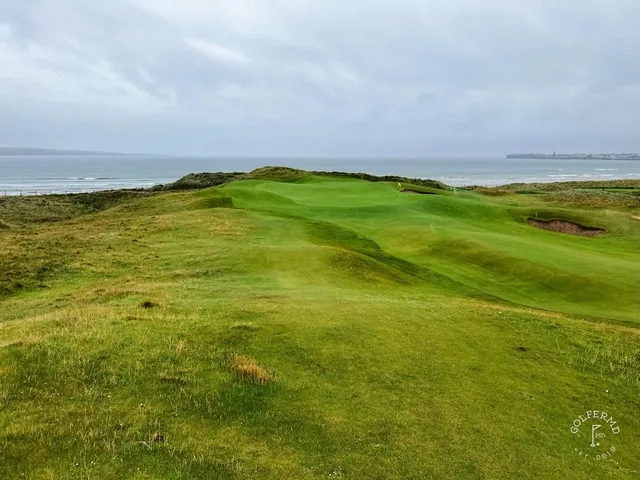Another view of that group at Lahinch, with the dunes and the water behind them.