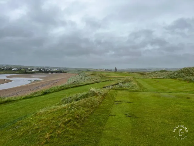A close view of a flagstick at Lahinch, framed by the dunes.