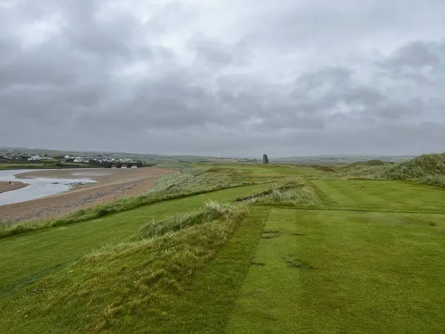 The goats and the dunes beside a hole at Lahinch.