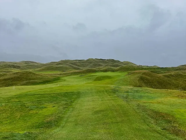 A fairway at Lahinch with the ocean filling the background.