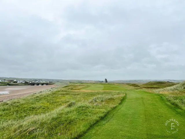 A last wide view of the Old Course at Lahinch, with the Atlantic on the horizon.