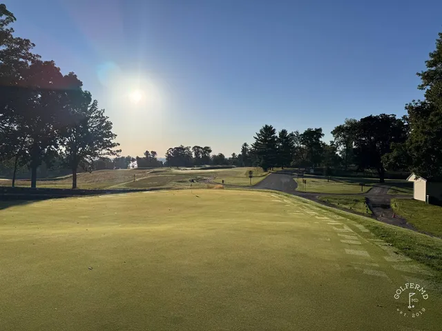 A fairway at Lawsonia Links, with the wide green and the trees in the distance.