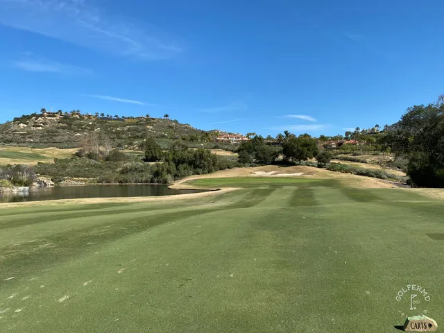 A fairway running through the hills at Maderas Golf Club, with bunkers along the hole.