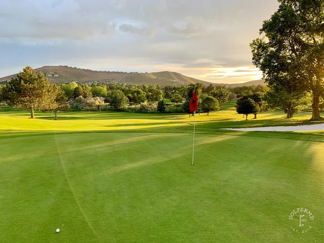 A fairway and green at Meadow Springs, with a bunker in the foreground.