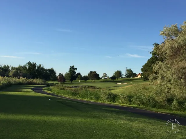 A wide hole at Meadow Springs, the fairway running toward the hills.