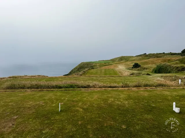 The cliffs and the Atlantic from the edge of a hole at Old Head.