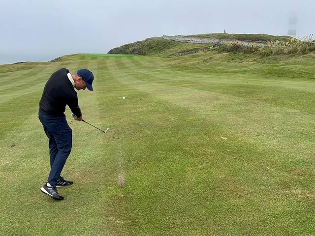A fairway at Old Head on the cliffs, with the Atlantic filling the background.
