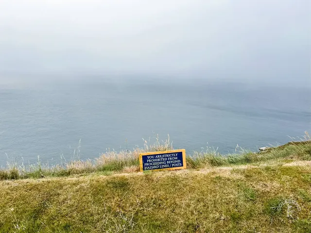 A fairway and green at Old Head, with a bunker short of the green.