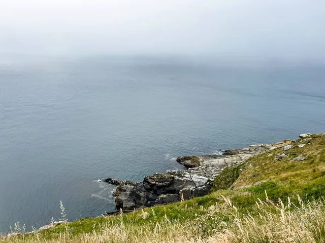 A wide hole at Old Head, with the ocean on the left and the right.