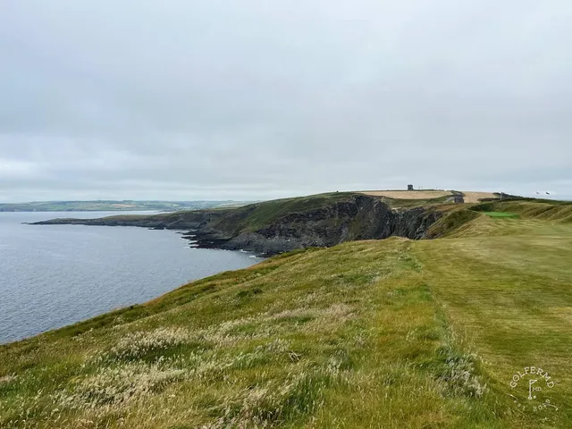 A wide view from the tee at Old Head, with the whole headland in sight.
