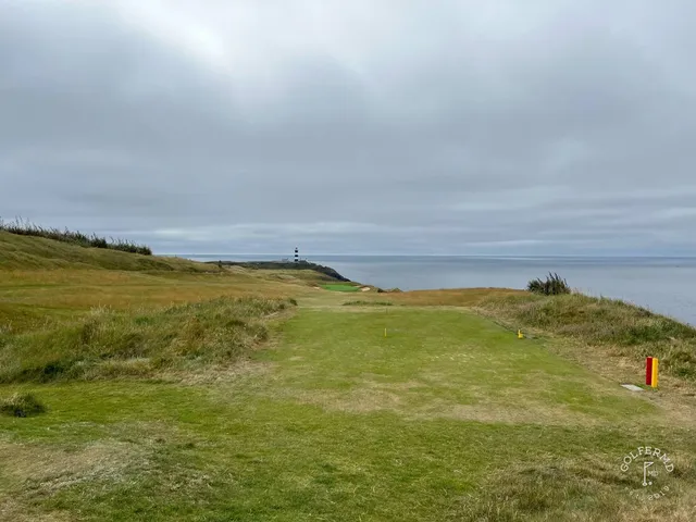 Golfers walking the cliff path between holes at Old Head.